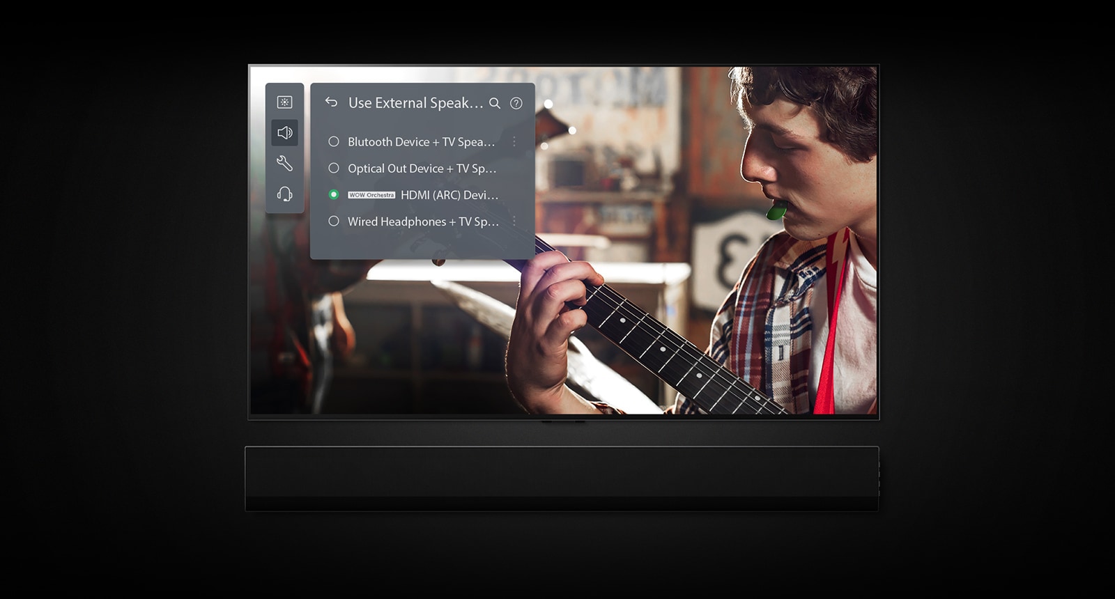 An image of an LG OLED TV with Soundbar. A video of a boy playing the guitar plays on screen with Soundbar Mode's settings overlayed on top.