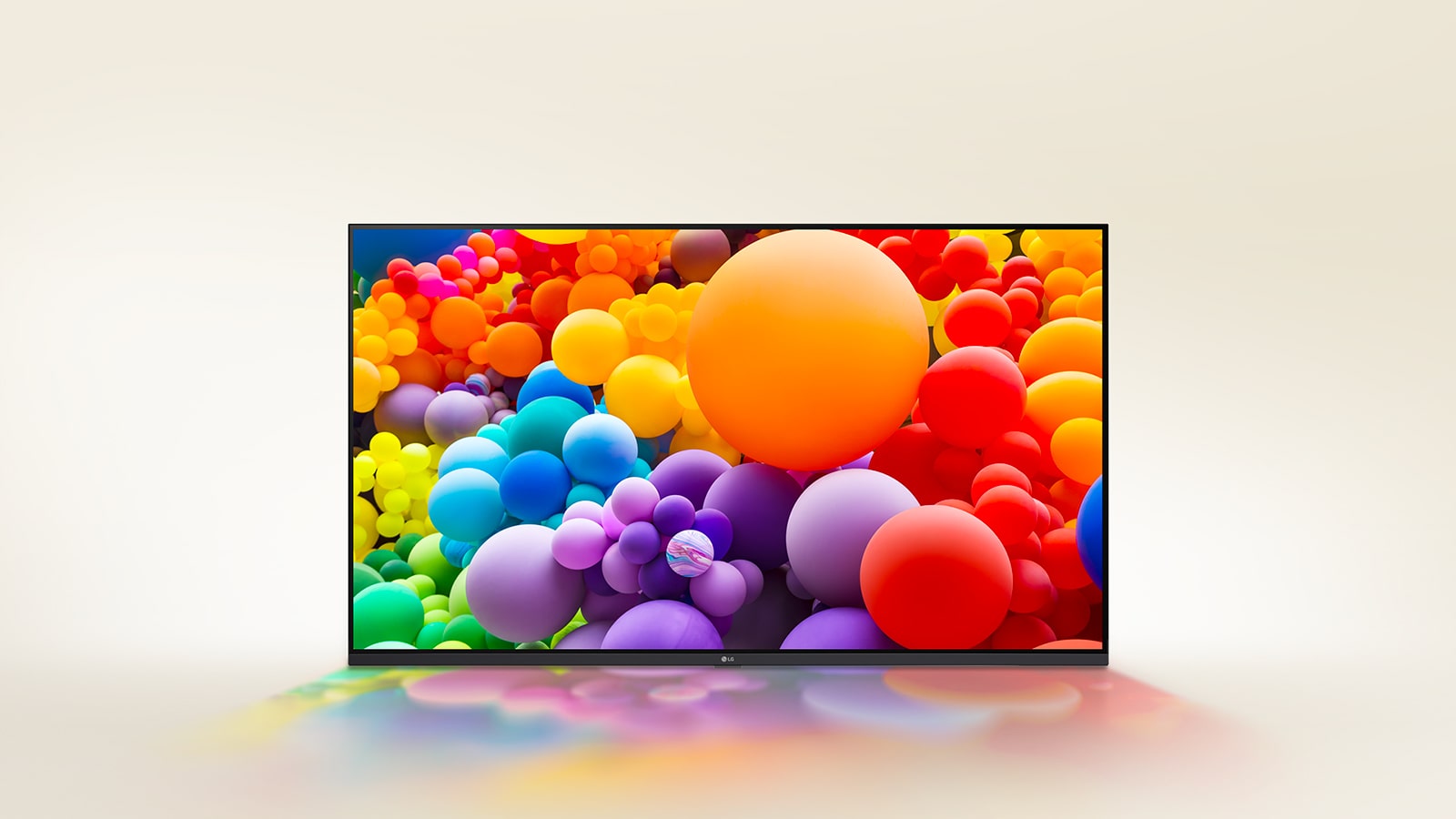 A room filled with vibrant colors, with circle shapes, and spiraling circles on the wall are displayed on LG UHD TV.