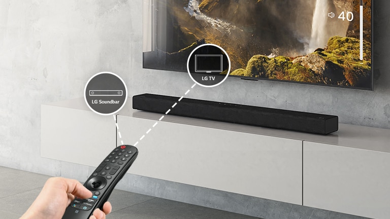 There is a LG remote control in someone's hand, controlling TV and sound bar at the same time. There are icons of LG TV and LG Sound bar. 