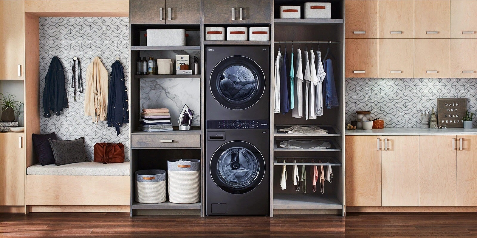 A black LG Wash Tower is installed with shelving and a laundry station on the left and a closet to the right.