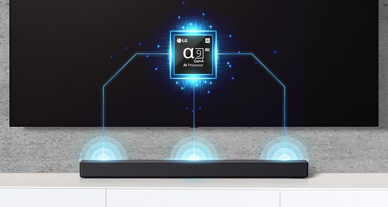 Det er et bilde av Alpha 9 gruppe på TV og det er en lydplanke like under. Det er også lydbølgeeffekt som kommer ut av lydplanken. 