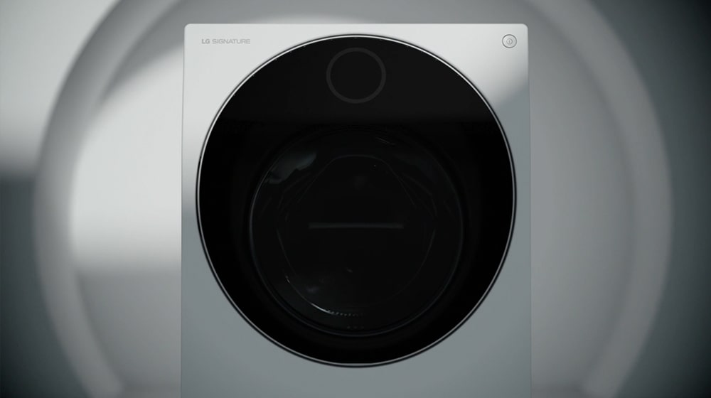 Den svarte døren til LG SIGNATURE Washing Machine er plassert i midten av bildet, som er en svart bakgrunn.