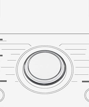 Dette er et forstørret bilde av metallknotten på panelet på en vaskemaskin.