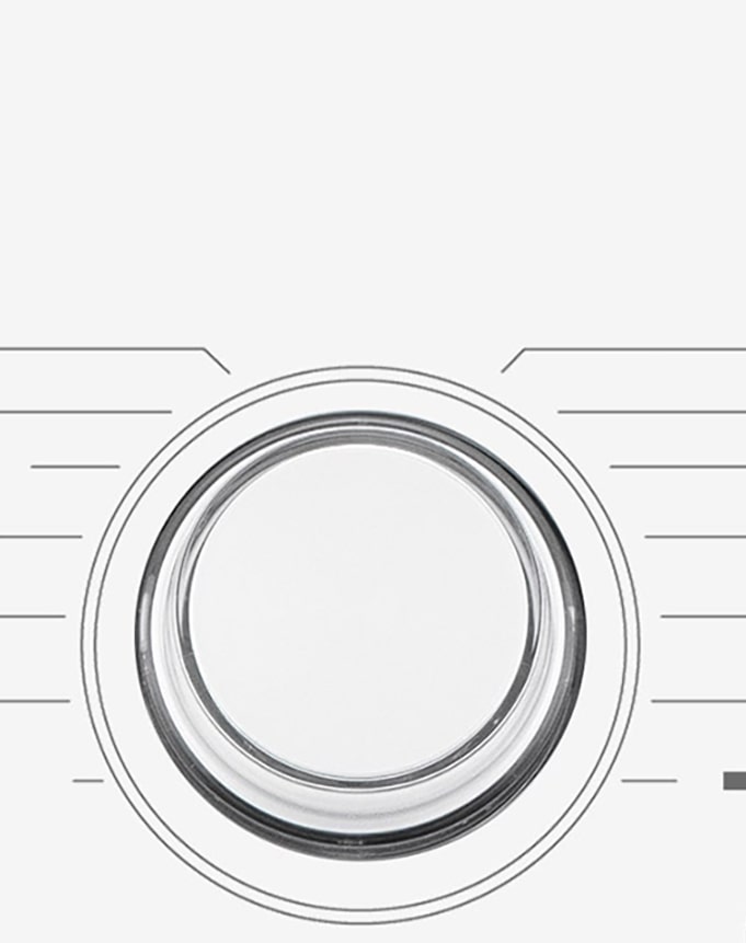 Dette er et forstørret bilde av metallskiven på panelet til en vaskemaskin.