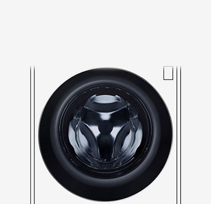 Bildet av innsiden av vaskemaskinen hvor de rustfrie trommelribbene kan sees.