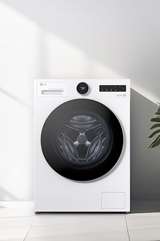 LG hvit frontmatet vaskemaskin med tørketrommel (WHX9516TLC) er plassert under sollys fra venstre, med noen planter synlige til høyre.