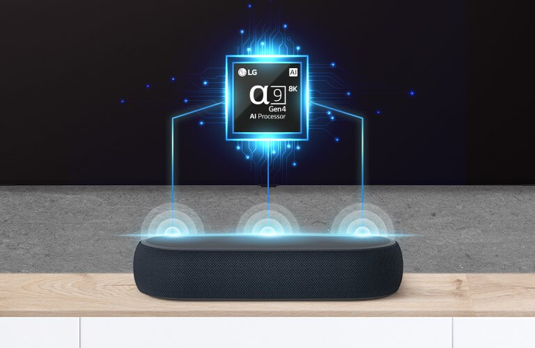 Det er et bilde av en alpha nine-brikke på TVen og det er en lydplanke like under. Det er også lydbølgeeffekt som kommer ut av lydplanken.