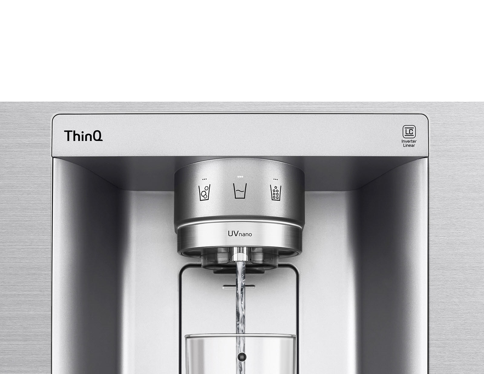 A video starts zoomed in on the water dispenser. The exterior of the refrigerator goes clear and now the interior of the door and mechanical parts of the dispenser nozzle can be seen. The video zooms in further to show the water droplets as they fall through the UVnano part of the nozzle which reduces the bacteria. The view zooms back out to see the exterior of the refrigerator again as water is being dispensed into a glass.