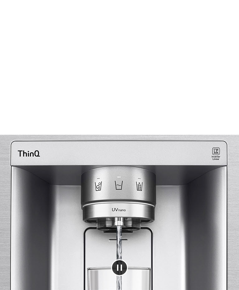 A video starts zoomed in on the water dispenser. The exterior of the refrigerator goes clear and now the interior of the door and mechanical parts of the dispenser nozzle can be seen. The video zooms in further to show the water droplets as they fall through the UVnano part of the nozzle which reduces the bacteria. The view zooms back out to see the exterior of the refrigerator again as water is being dispensed into a glass.