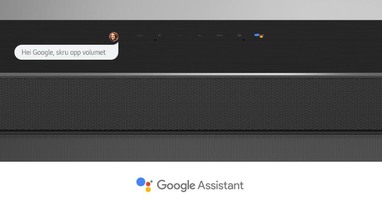 Nærbilde av LG-lydplankens midtseksjon med lydkontroller og Google Assistant-logoen. Du kan skru opp volumet med Googles talekommandoer. 