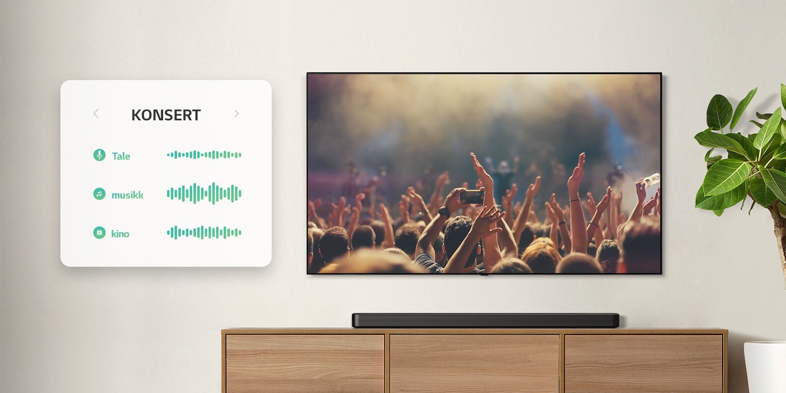 TVen er på veggen. TV viser mennesker som klapper på en konsert, kanalen byttes til en filmscene med en bil som kjører i en skog, kanalen byttes nok en gang, nå til nyheter med en nyhetsanker som snakker. LG Lydplanke er like under TV på en beige hylle. (spill av videoen)