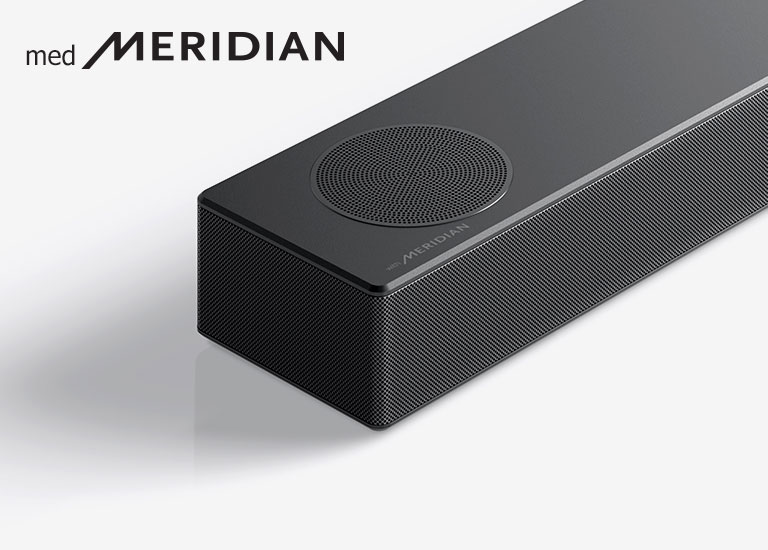Nærbilde av LG-lydplankens venstre side med Meridian-logoen vist på nedre venstre hjørne av produktet.