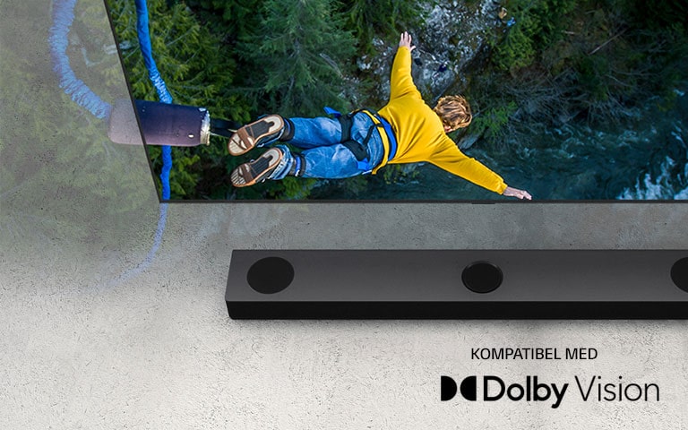 "LG-TV-en viser en person som hopper strikk, og LG-lydplanken er plassert  under TV-en."
