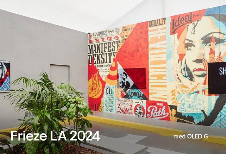 OLED G montert midt i Shepard Fairey-veggmaleriet.