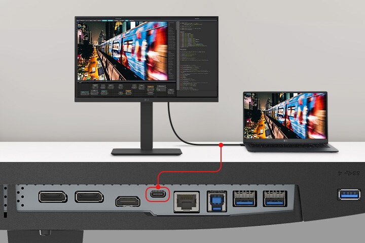 Et bilde av en bærbar PC og en skjerm som er koblet sammen med én enkelt USB Type-C-kabel.