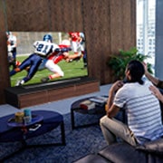 LG 55'' LG OLED 4K TV - CX, People watching a American football game on TV in the living room, OLED55CX6LA, thumbnail 11