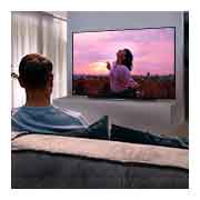LG 77'' LG OLED 4K TV - CX, A couple sitting on a sofa in the living room watching a romantic movie on TV, OLED77CX6LA, thumbnail 10