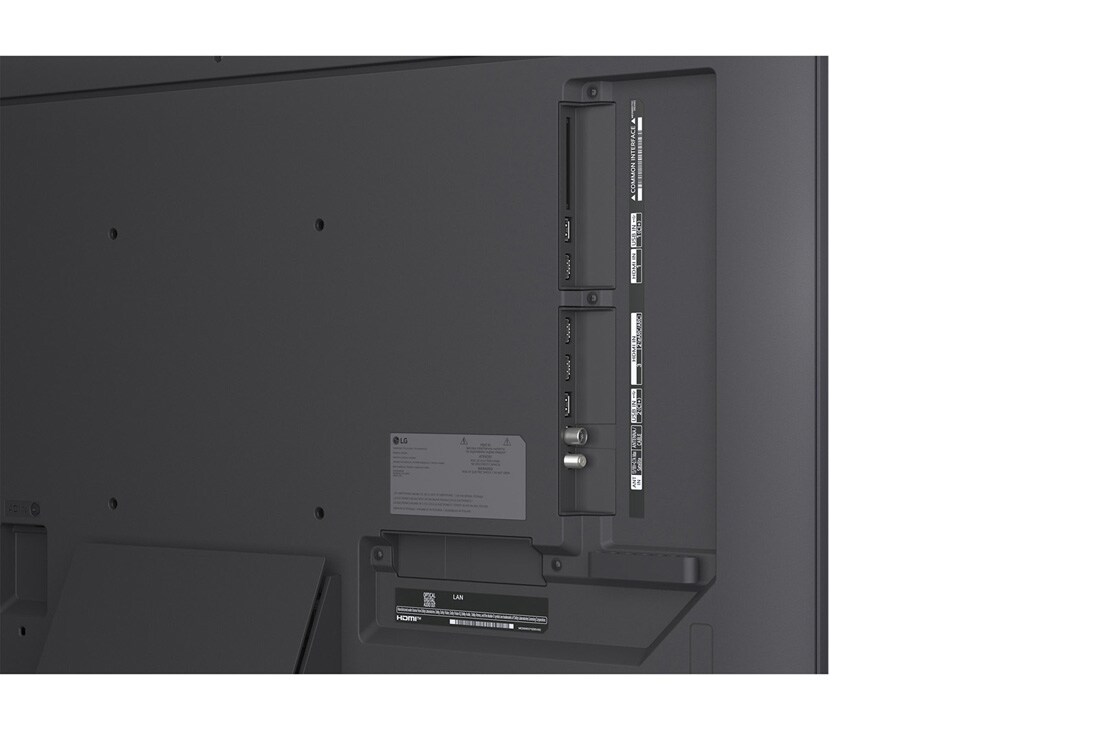 LG 43'' QNED evo MiniLED QNED87 4K AI TV - 2026, LG QNED evo AI QNED85 Mini LED med supertynn design er veggmontert i et lyst, åpent oppholdsrom og smelter inn i interiøret mens den viser dristige geometriske abstrakte kunstverk., 43QNED87B6A, thumbnail 12
