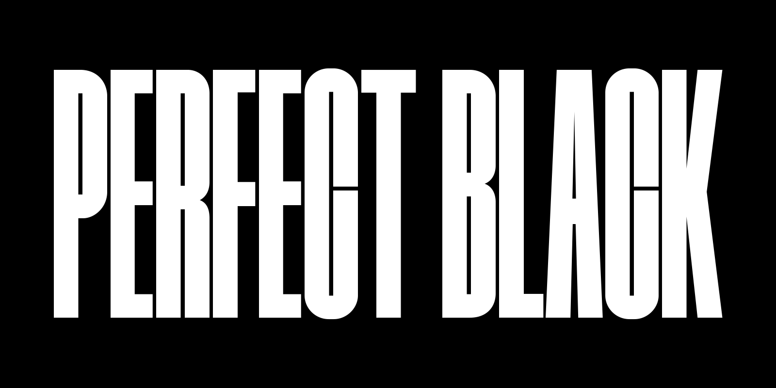 The words 'PERFECT BLACK' in white on a black background. A well-lit rocky mountain range appears in front, then moves upwards to reveal the landscape below as the words 'PERFECT BLACK' fade away.