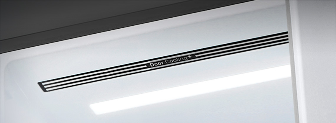 A diagonal view up into the top of the refrigerator showing the soft LED lighting.