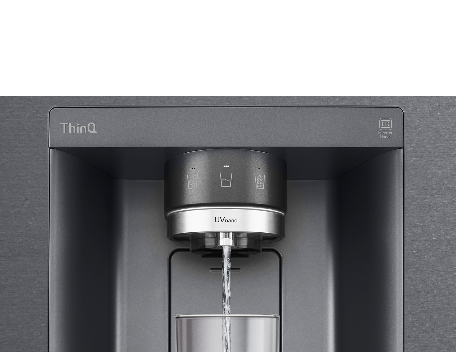 A video starts zoomed in on the water dispenser. The exterior of the refrigerator goes clear and now the interior of the door and mechanical parts of the dispenser nozzle can be seen. The video zooms in further to show the water droplets as they fall through the UVnano part of the nozzle which reduces the bacteria. The view zooms back out to see the exterior of the refrigerator again as water is being dispensed into a glass.