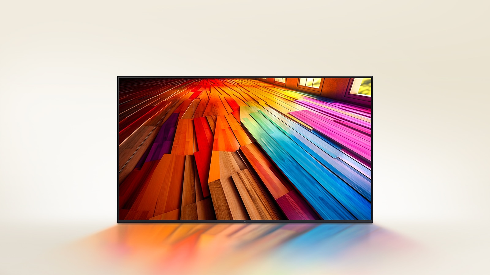 An image of a vibrantly colored, long stretch of hardwood flooring is displayed on an LG TV. The colors lightly reflect on the space below the TV.