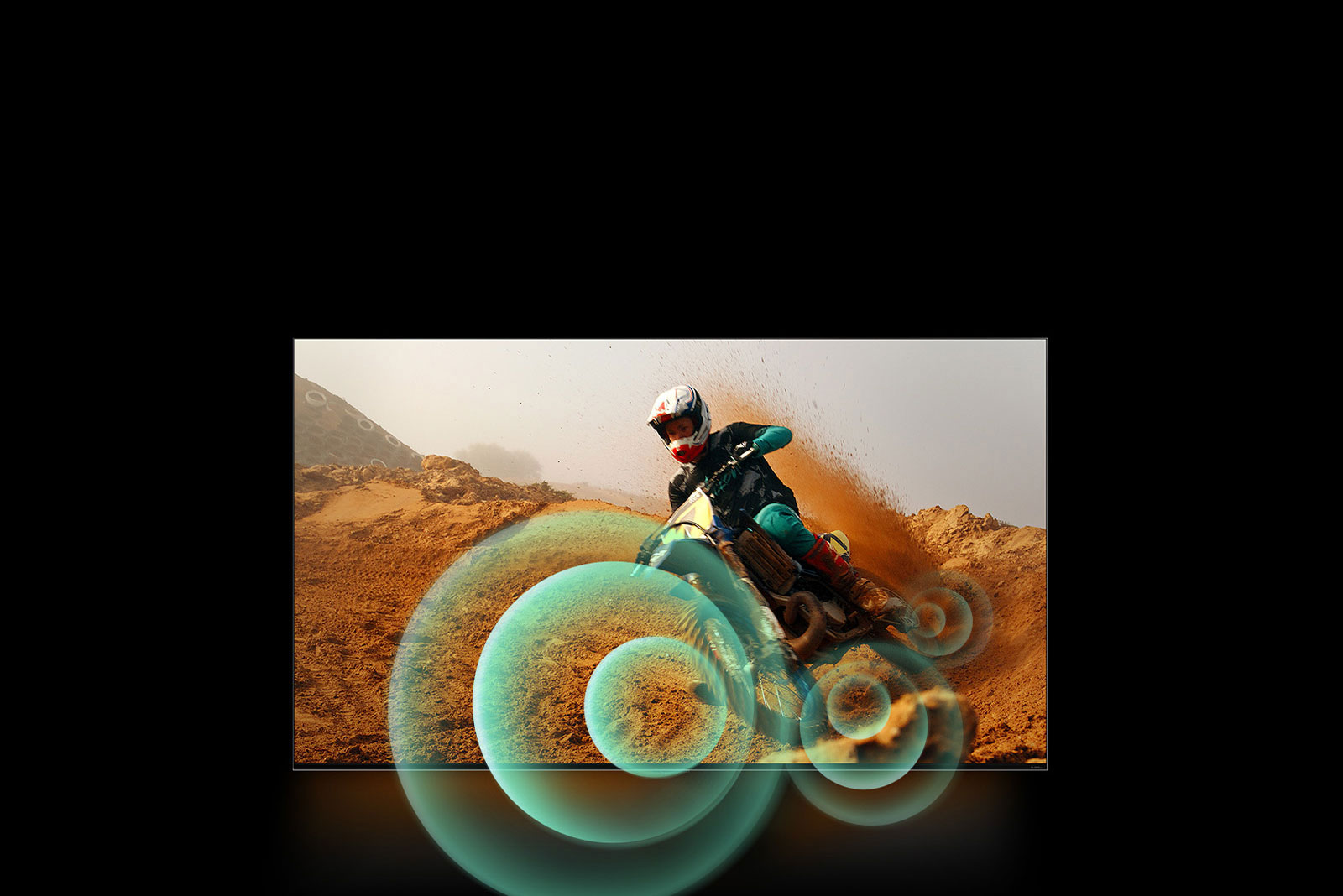 An image of a man riding a motorbike on a dirt track with bright circle graphics around the motorbike.