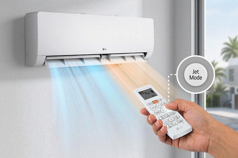 Wall-mounted air conditioner releasing cool air while a hand operates the remote control with Jet Mode feature.