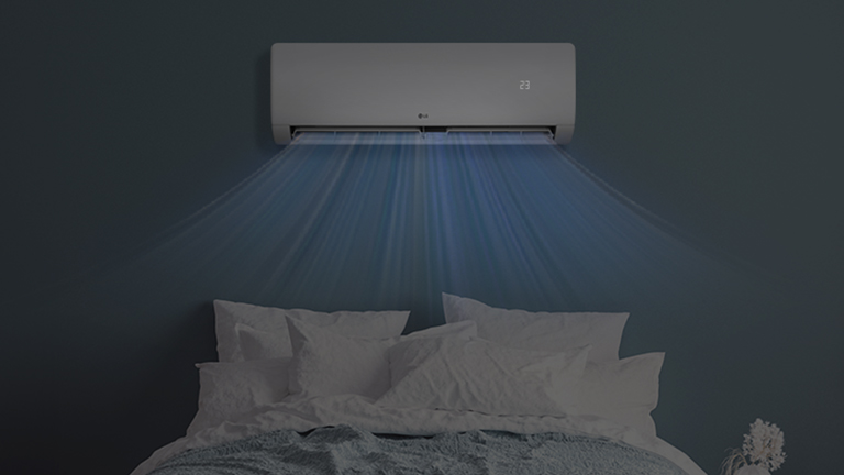 Dim bedroom with the air conditioner display visible without disturbing sleep.