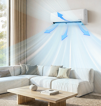 A wall-mounted air conditioner blowing cool air into a modern, minimalist living room with a beige sofa.