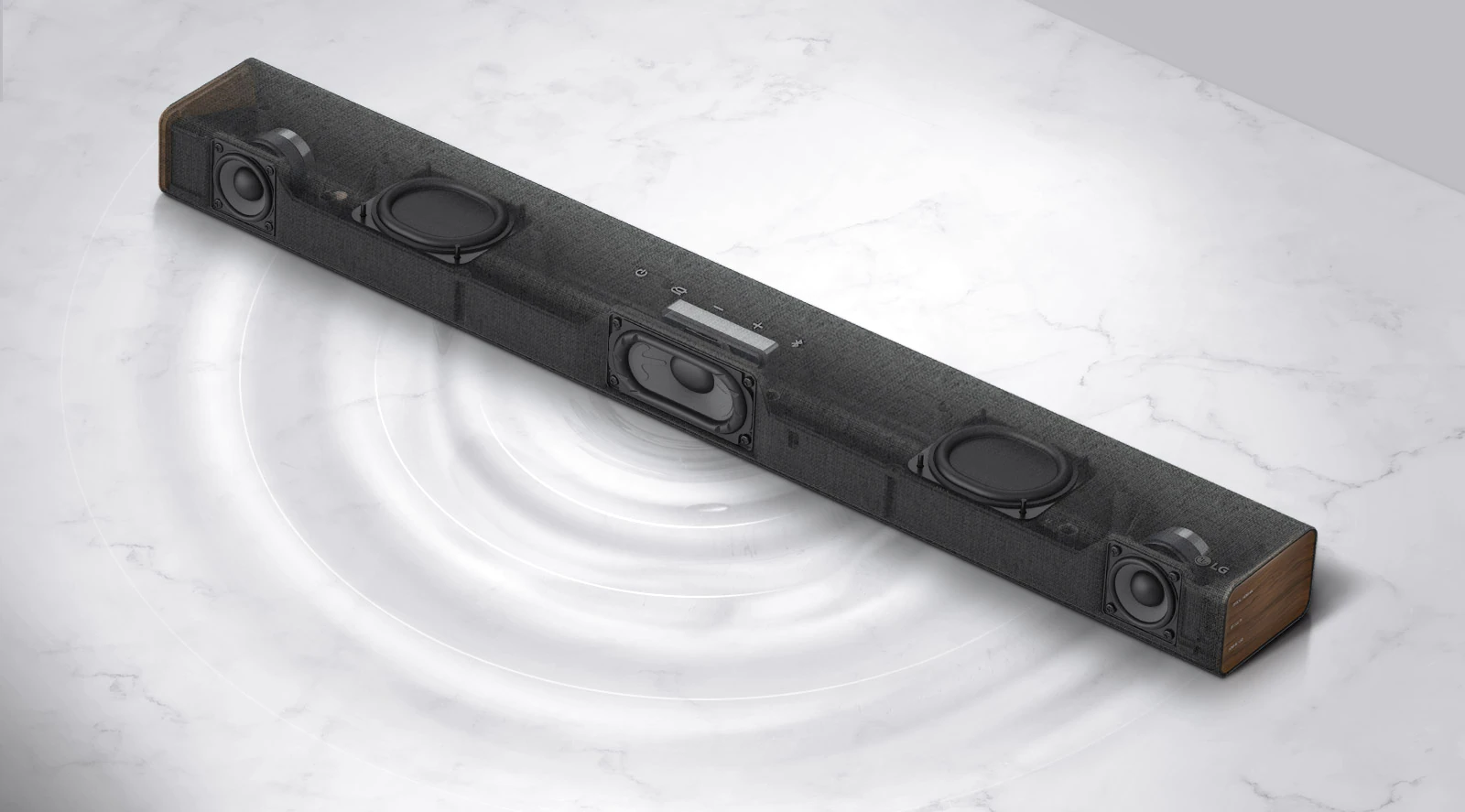 Diagonal view of transparent LG soundbar with the right side forward. Built-in subwoofer and dual passive radiators inside of a product are shown and graphic of wavelength is shown on a white marble floor.