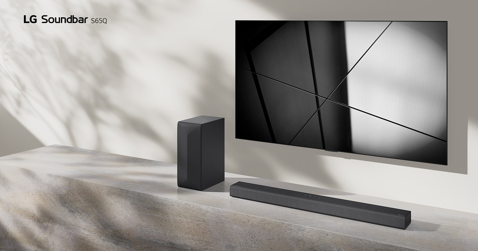 LG sound bar S65Q and LG TV are placed together in the living room. The TV is on, displaying a black and white image.