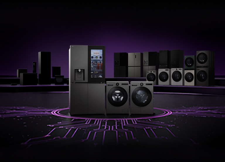 Lineup of LG home appliances including refrigerators, washing machines, dryers, and kitchen appliances displayed on a dark stage with a circuit board pattern floor	