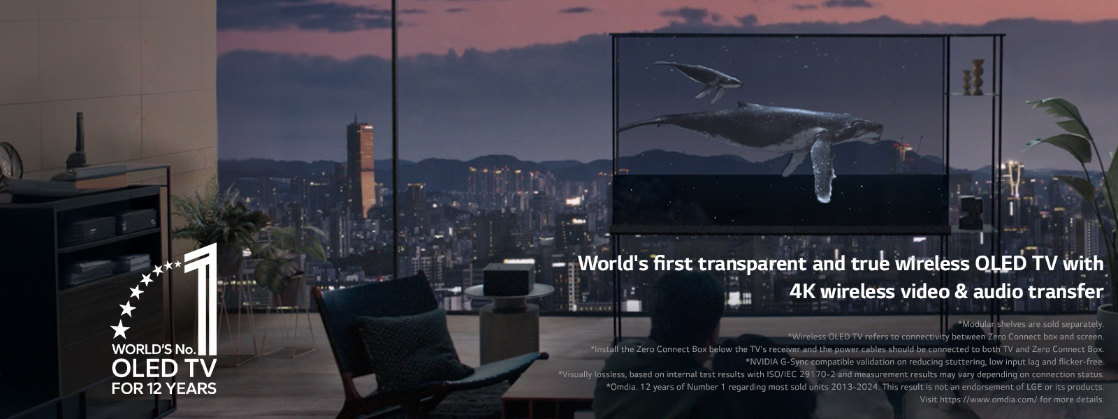 Whale swims across LG SIGNATURE OLED T as the shade is drawn down to show the evening city skyline. People are sitting on the couch in the foreground facing the TV and window. Zero Connect Box is located on an small table to the left of the TV. 