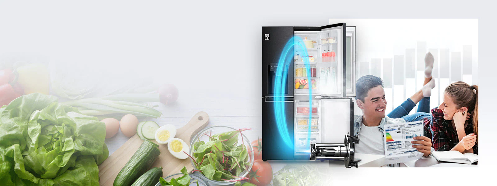 An LG refrigerator with one side of doors open displaying produce and drinks inside is in the background along with a magnified image of fresh produce. Just in front of it is the LG Inverter Linear Compressor with a blue neon oval showing the energy from the machine in the refrigerator. Also in the image is a man and woman smiling at each other as the man holds an energy usage chart for the refrigerator.