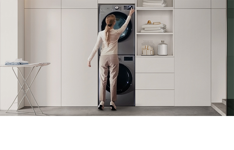 The video contains several comparison scenes. Stackable washer and dryer, each with a control panel, shows the inconvenience of an adult woman sticking out her heel to operate the panel. Meanwhile, the LG Objet Washtower™ shows that the washing machine and dryer can be centrally controlled as a single unit, so even a young boy can easily access it.