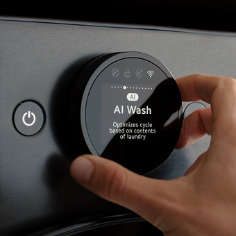 Hand adjusting AI Wash cycle on LG washing machine using smart control dial