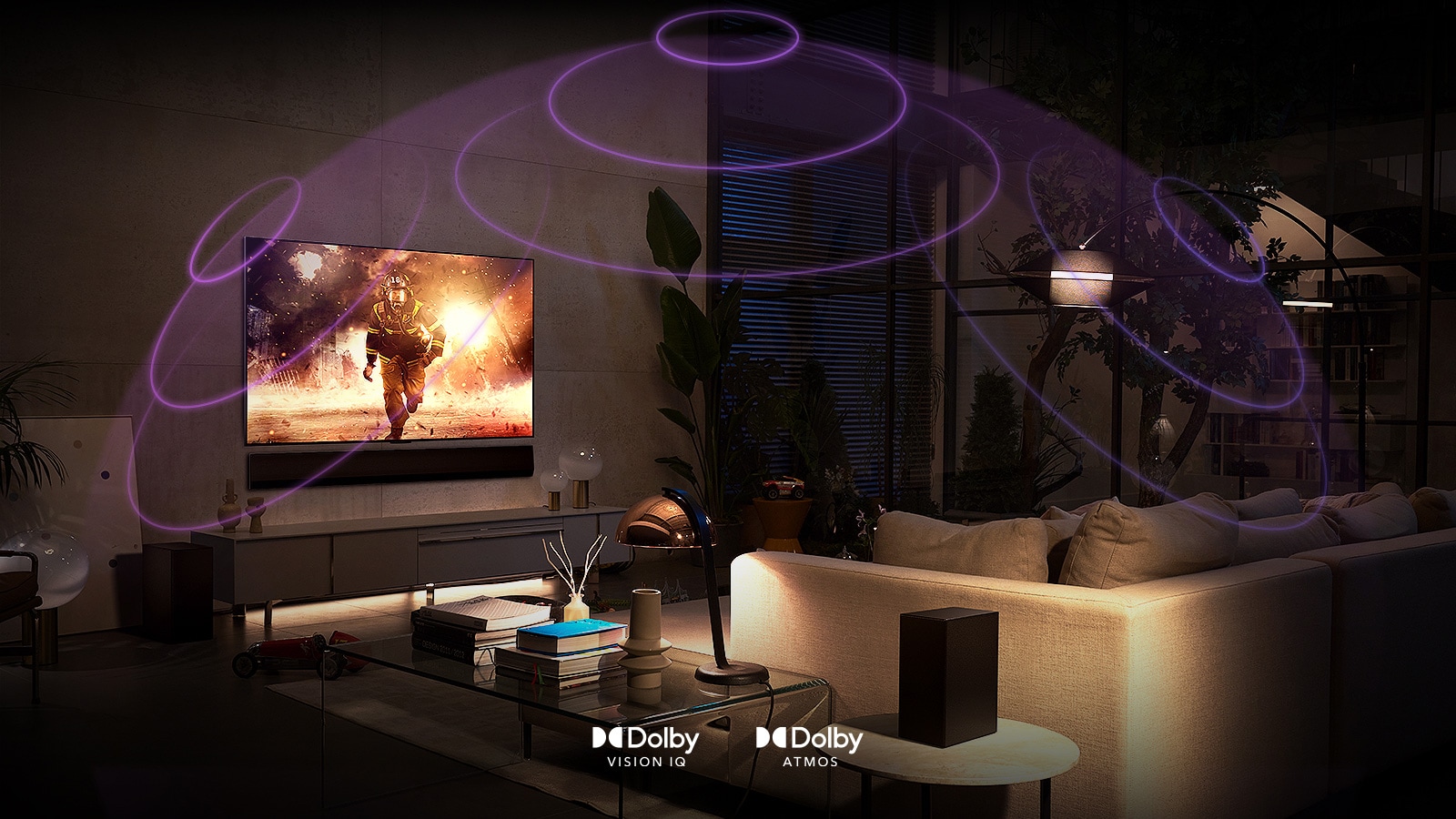 An image of an LG OLED TV in a dimly lit room showing a sci-fi movie. Soundwaves create a dome around the sofa and TV, depicting the immersion of Dolby Atmos and Dolby Vision.