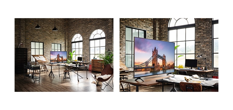 A TV displaying a picture of London Bridge is in an antique workroom<br>A close up of a TV displaying a picture of London Bridge is on a table in an antique workroom.