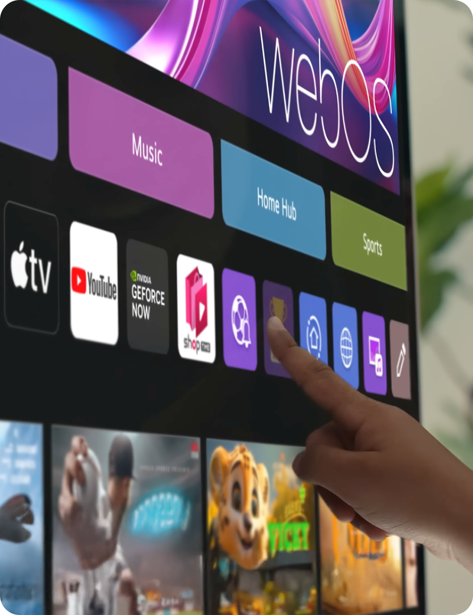 Hand touching the LG 360 monitor