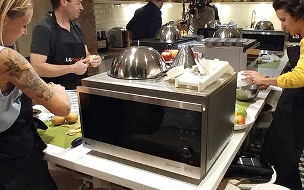 A image of a group of people cooking with LG NeoChef microwave at the competition