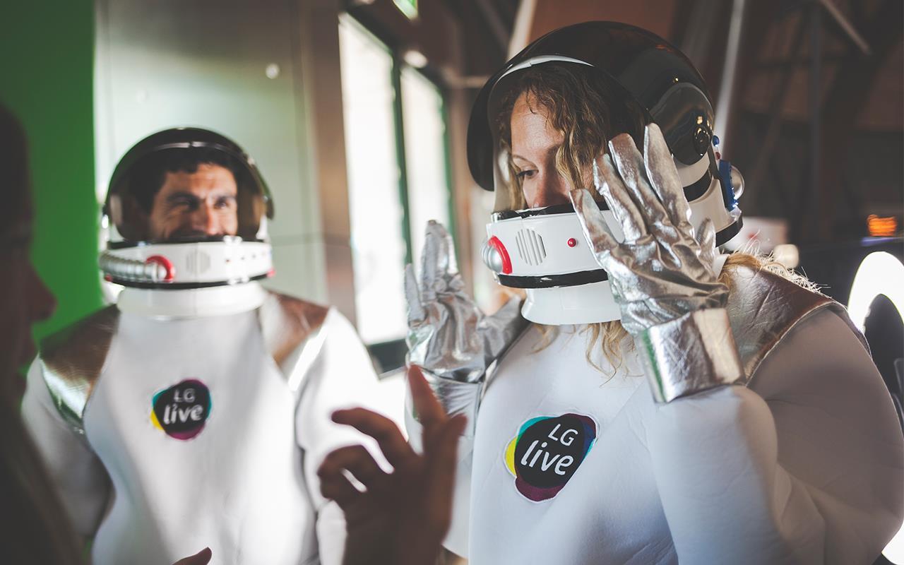 Two people who wear spacesuit of LG live.