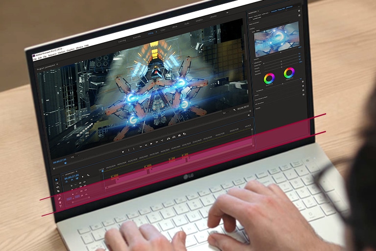 Un utilizator lucrează pe un ecran mare cu un raport de aspect de 16:10. O parte mărită comparativ cu raportul 16:9 este evidențiată cu roșu.