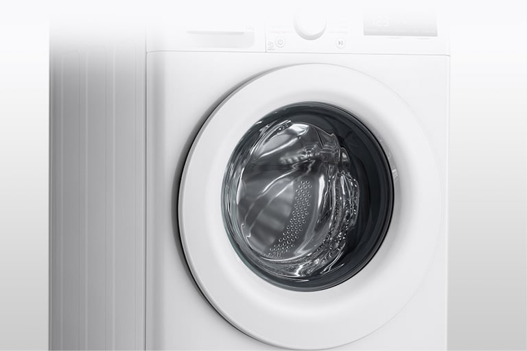 Imaginea mașinii de spălat cu ușa din sticlă securizată vizibilă în mod clar.