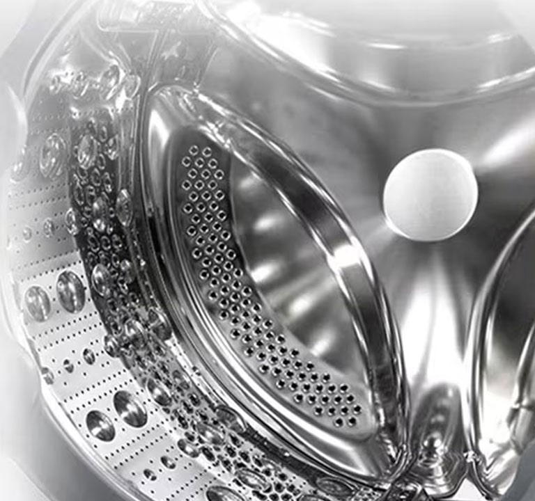 Imaginea din interiorul mașinii de spălat unde se poate vedea ridicătorul din oțel inoxidabil.