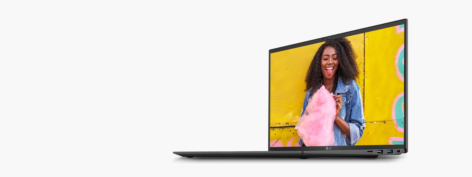 Acesta arată produsul cu vizualizarea ecranului pe care este afișată o femeie care ține o vată de zahăr roz în fața peretelui galben, pentru a exprima expresiile de culoare detaliate ale afișajului IPS.