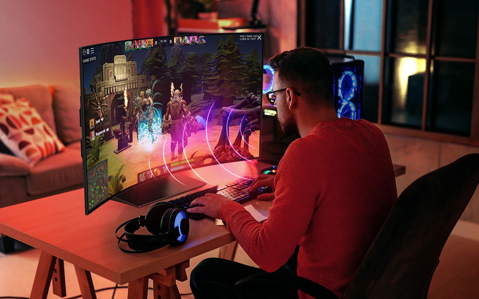 An image of a man playing a game on LG OLED Flex. Sound bubbles depicting speech are shown around his mouth.