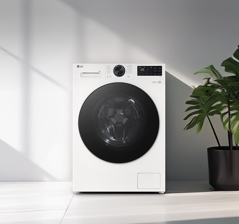 „Mașină de spălat cu încărcare frontală, amplasată într-o spălătorie modernă.”