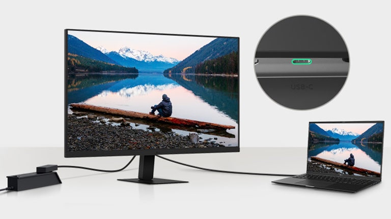 O imagine cu un laptop și un monitor conectate cu un singur cablu USB-C.