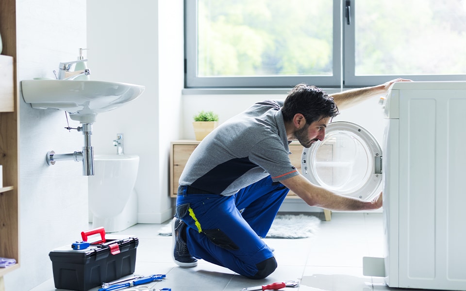 Technician servicing LG washing machines